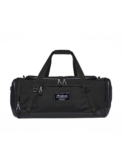 Scuffle Duffle combat sports gym bag in Volcanic Black, front view with carry handles and Scraphouse label