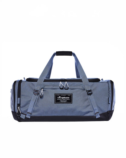 Scuffle Duffle combat sports gym bag in Thundercloud Blue, front view with carry handles and Scraphouse label